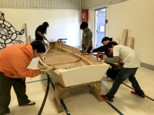 Students at Pictou Landing First Nation put finishing touches on a new boat
